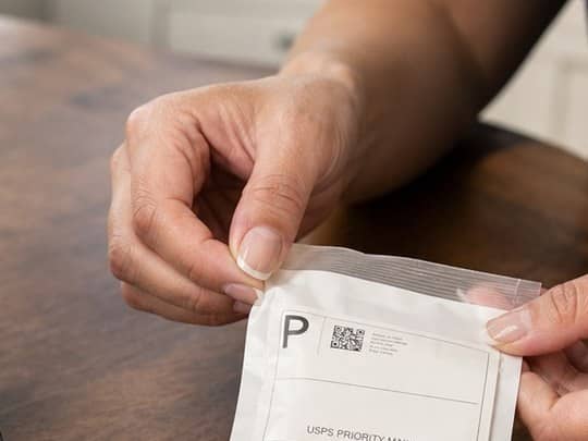 Returning the saliva kit by mail